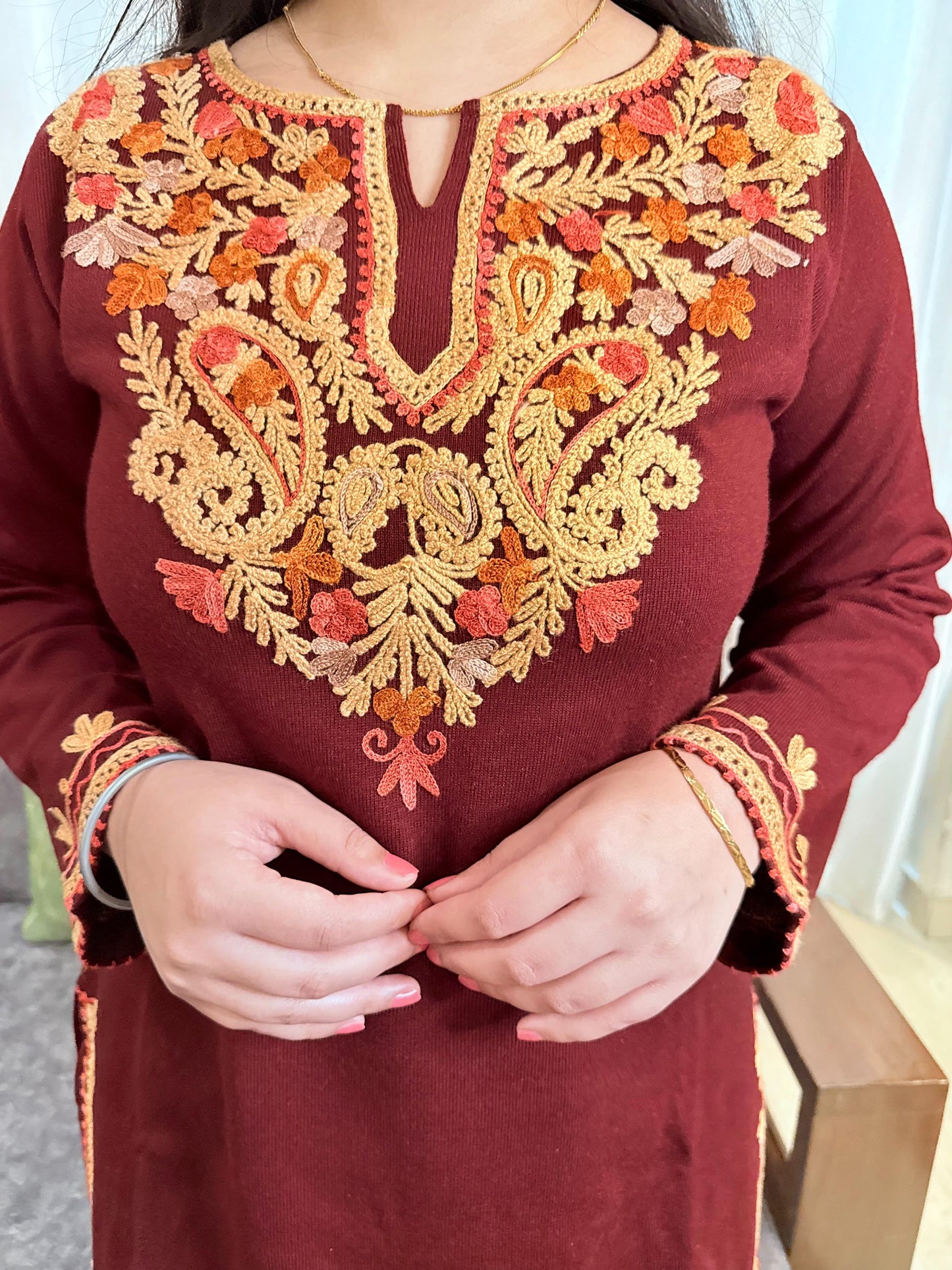 Maroon traditional outfit with intricate gold and orange embroidery GulmoharMaroonEmbroideredKashmiriWoollenKurti1
