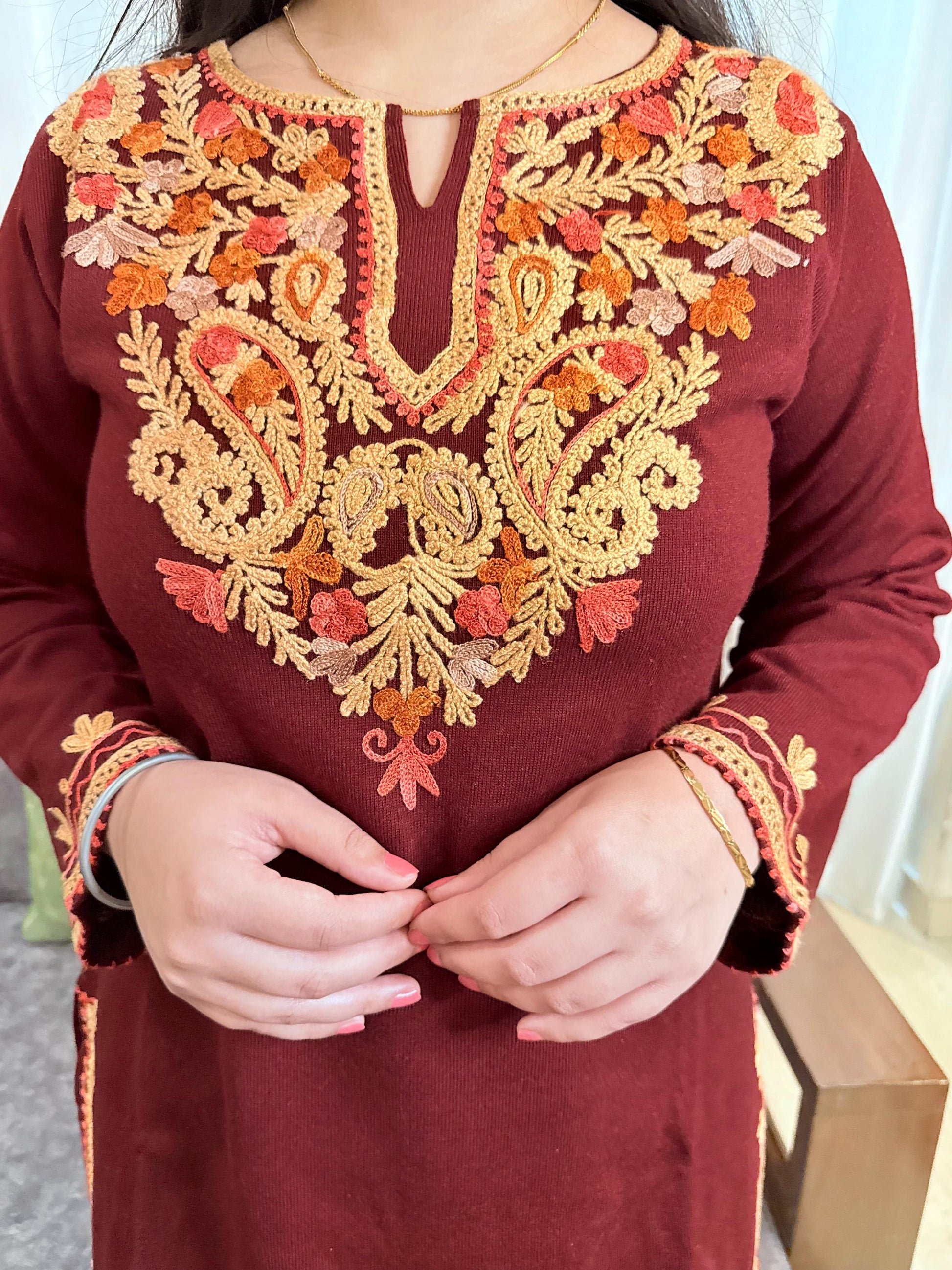 Maroon traditional outfit with intricate gold and orange embroidery GulmoharMaroonEmbroideredKashmiriWoollenKurti1